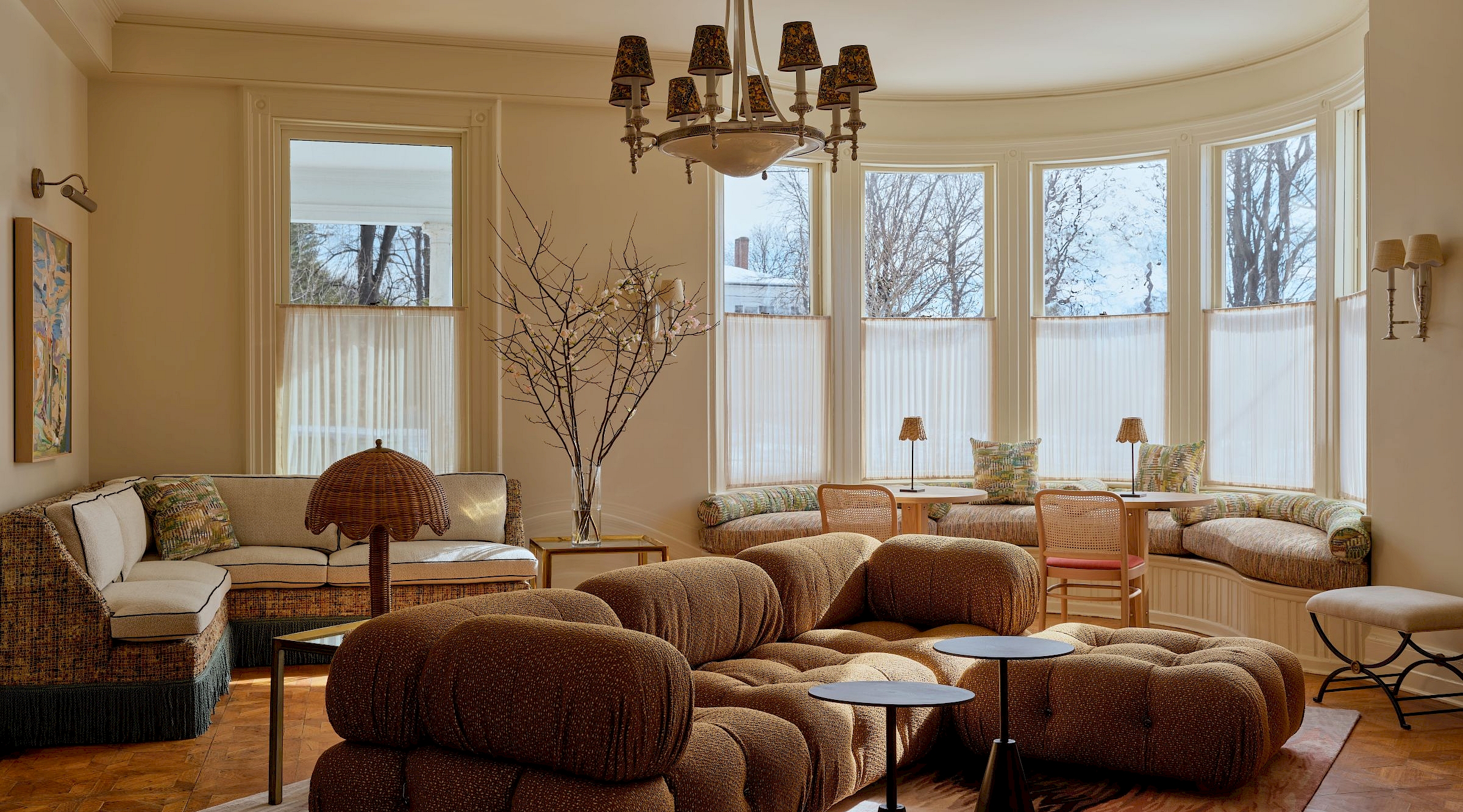 A lush dining room with fireplace and cozy seating
